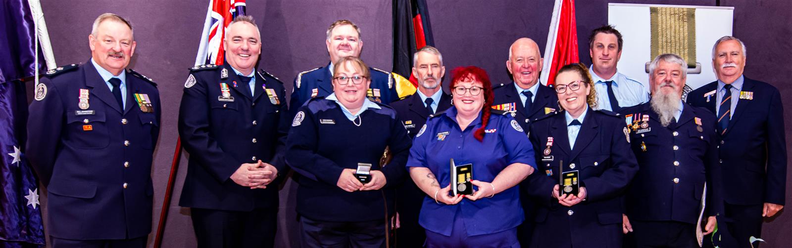 DCO Bill Johnstone, Chief Officer Jason Heffernan, Rochester Captain Luke Warren, Cade Kindness, Vaughan Thomas, Brent Sweeney, Board Member Peter Shaw AFSM. Front row: Heidi Warren, Hayley Ettershank, Tania Barkby, Raymond Liddicoat